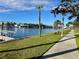 Relaxing waterfront walkway with lush landscaping and scenic views at 410 W Lemon St, Tarpon Springs, FL 34689