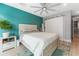 Bright bedroom with a comfortable bed, ceiling fan, and sliding barn door at 4208 Harbor House Dr, Tampa, FL 33615