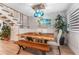 Bright dining area featuring a unique wooden table and stylish light fixture at 4208 Harbor House Dr, Tampa, FL 33615