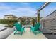 Relaxing waterfront dock with teal chairs overlooking the calm water at 4208 Harbor House Dr, Tampa, FL 33615