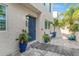 Well-maintained front entry with blue door and potted plants at 4208 Harbor House Dr, Tampa, FL 33615