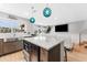 Modern kitchen island with white countertop and stainless steel appliances at 4208 Harbor House Dr, Tampa, FL 33615