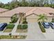 Aerial view of a two-story home with attached garage and landscaped yard at 430 Cedar Falls Dr, Apollo Beach, FL 33572