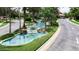 Gated community entrance with a scenic water feature at 430 Cedar Falls Dr, Apollo Beach, FL 33572