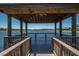 Wooden gazebo overlooking a peaceful lake at 430 Cedar Falls Dr, Apollo Beach, FL 33572