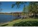 Charming gazebo over the lake with wooden deck and scenic views at 430 Cedar Falls Dr, Apollo Beach, FL 33572