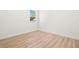 Bedroom with light wood flooring and a window at 4351 56Th N Ave, St Petersburg, FL 33714