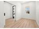 Bright bedroom with light wood flooring and sliding barn door at 4351 56Th N Ave, St Petersburg, FL 33714