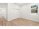 Bedroom with light wood flooring, white walls, and a window at 4351 56Th N Ave, St Petersburg, FL 33714