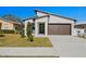 Modern house exterior with a brown garage door and landscaping, creating curb appeal at 4351 56Th N Ave, St Petersburg, FL 33714