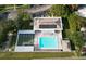 Aerial view showing pool, shuffleboard, and clubhouse at 4361 Tahitian Gardens Cir # C, Holiday, FL 34691