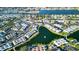 Aerial view showing condo location in a community near a lake at 4361 Tahitian Gardens Cir # C, Holiday, FL 34691