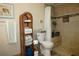 Clean bathroom with shower, toilet and wicker towel rack at 4361 Tahitian Gardens Cir # C, Holiday, FL 34691