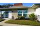 Condo exterior showcasing a neat lawn and updated facade at 4361 Tahitian Gardens Cir # C, Holiday, FL 34691