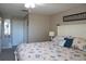 King-size bed, coastal decor, and large window with blinds at 4361 Tahitian Gardens Cir # C, Holiday, FL 34691