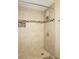 Updated shower with tile surround and built-in shelving at 4361 Tahitian Gardens Cir # C, Holiday, FL 34691