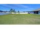 Large grassy backyard with privacy fence at 4439 Devinshire Fields Loop, Plant City, FL 33567