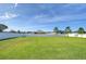 Spacious backyard featuring a large grassy area and a white fence at 4439 Devinshire Fields Loop, Plant City, FL 33567