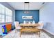 Farmhouse-style dining room with a wooden table and bench at 4439 Devinshire Fields Loop, Plant City, FL 33567