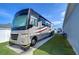 Dedicated RV parking area with concrete pad, providing convenient RV storage at 4439 Devinshire Fields Loop, Plant City, FL 33567