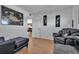 Living room with leather couches and Asian-inspired wall art at 4650 Cove Cir # 509, St Petersburg, FL 33708