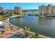 Aerial view showcasing a waterfront pool and surrounding community at 4650 Cove Cir # 509, St Petersburg, FL 33708