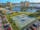 An aerial view of a community tennis court with surrounding parking at 4650 Cove Cir # 509, St Petersburg, FL 33708