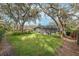 Expansive backyard with spacious lawn and mature trees at 6017 Hammock Hill Ave, Lithia, FL 33547