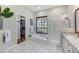 Spa-like bathroom with a soaking tub, walk-in shower, and walk-in closet at 6017 Hammock Hill Ave, Lithia, FL 33547