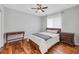 Bright bedroom with wood floors and a comfortable bed at 6017 Hammock Hill Ave, Lithia, FL 33547