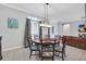 Dining room with round table and chairs, offering view into Gathering room at 6017 Hammock Hill Ave, Lithia, FL 33547