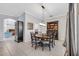 Elegant dining room featuring a large table, hutch, and chandelier at 6017 Hammock Hill Ave, Lithia, FL 33547