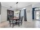 Bright dining room with a round table and six chairs, featuring built in hutch at 6017 Hammock Hill Ave, Lithia, FL 33547