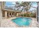 Inviting screened-in pool area with a spacious patio and lounge chairs at 6017 Hammock Hill Ave, Lithia, FL 33547