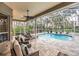 Spacious pool and patio area with screened enclosure at 6017 Hammock Hill Ave, Lithia, FL 33547