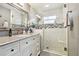 Elegant bathroom with a walk-in shower and modern fixtures at 6040 Antrim St, New Port Richey, FL 34653