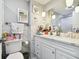 Clean bathroom, featuring a white vanity with a quartz countertop at 6040 Antrim St, New Port Richey, FL 34653