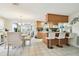 Dining room adjacent to kitchen, featuring a glass-top table at 6040 Antrim St, New Port Richey, FL 34653