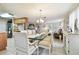 Spacious dining area with striped chairs and glass top table at 6040 Antrim St, New Port Richey, FL 34653