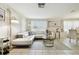 Bright living room featuring a white sectional sofa and large windows at 6040 Antrim St, New Port Richey, FL 34653