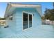 Blue deck with glass doors and water view at 6416 Finance Ave, Weeki Wachee, FL 34607