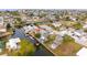 Aerial view showcasing waterfront property and neighborhood at 6800 Sanderling Ln, Hudson, FL 34667