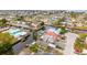 Aerial view of waterfront homes with boats and lush landscaping at 6800 Sanderling Ln, Hudson, FL 34667