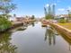 Peaceful canal view showcasing waterfront homes and lush landscape at 6800 Sanderling Ln, Hudson, FL 34667