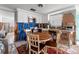 Kitchen with white cabinets and a wood table at 6800 Sanderling Ln, Hudson, FL 34667