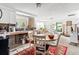 Combined kitchen and dining area with a red rug at 6800 Sanderling Ln, Hudson, FL 34667