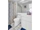 Clean bathroom with white vanity, toilet and shower/tub combo at 7120 Hideaway Trl, New Port Richey, FL 34655