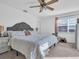 Main bedroom with a king-size bed and ceiling fan at 7120 Hideaway Trl, New Port Richey, FL 34655