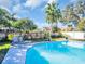 Relaxing pool area with lounge chairs and lush landscaping at 7120 Hideaway Trl, New Port Richey, FL 34655