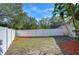 Backyard with privacy fence and mulch beds at 7136 Colony Pointe Dr, Riverview, FL 33578